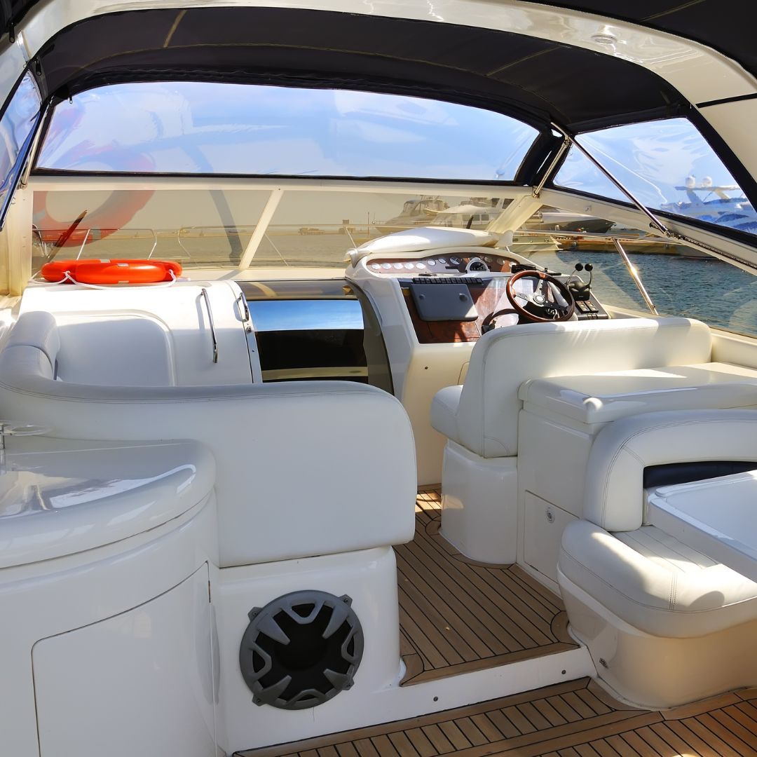 A sleek white boat featuring a pristine white interior, reflecting elegance and simplicity on the water.