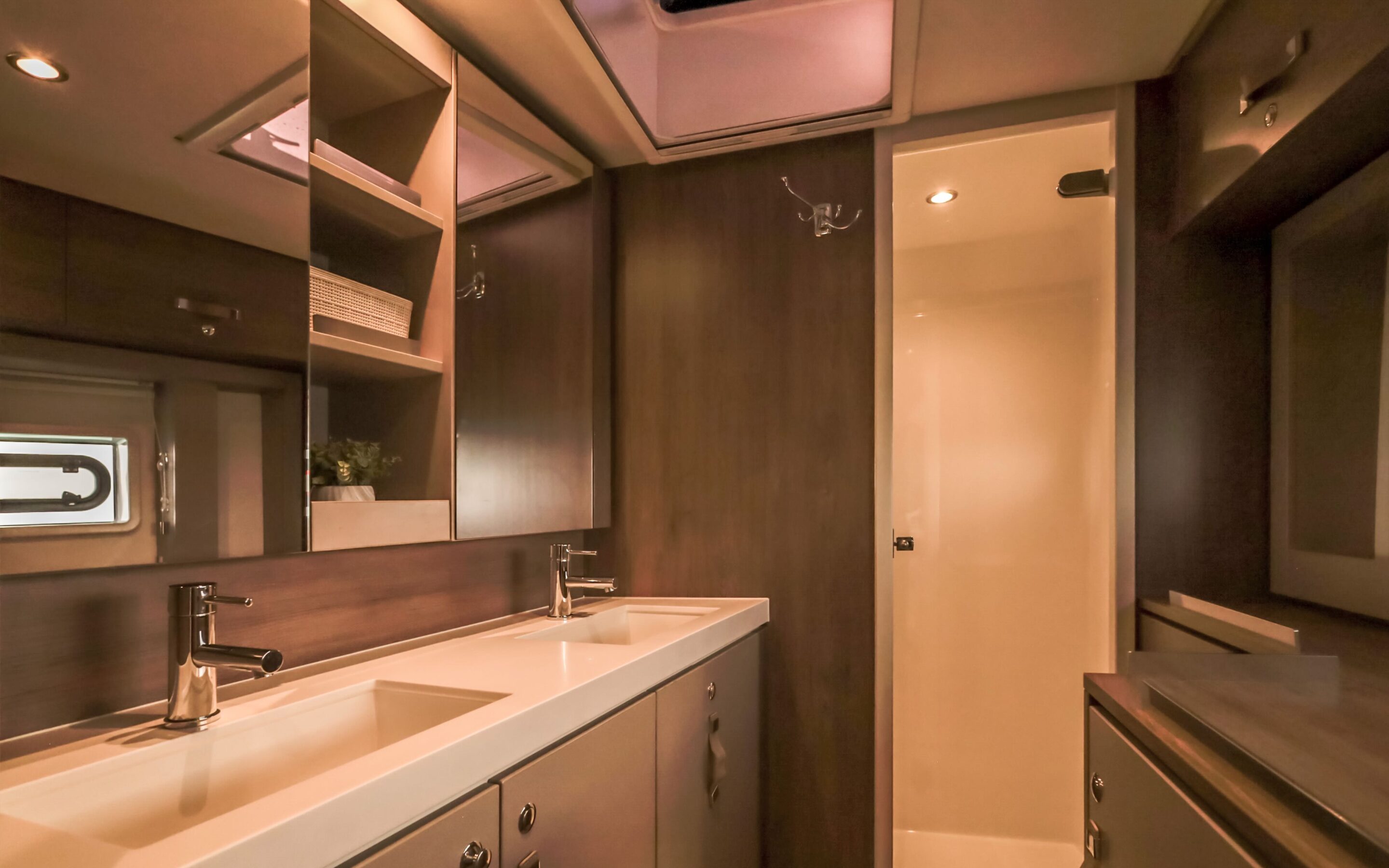 A bright bathroom featuring a skylight above a modern sink, creating an airy and inviting atmosphere.