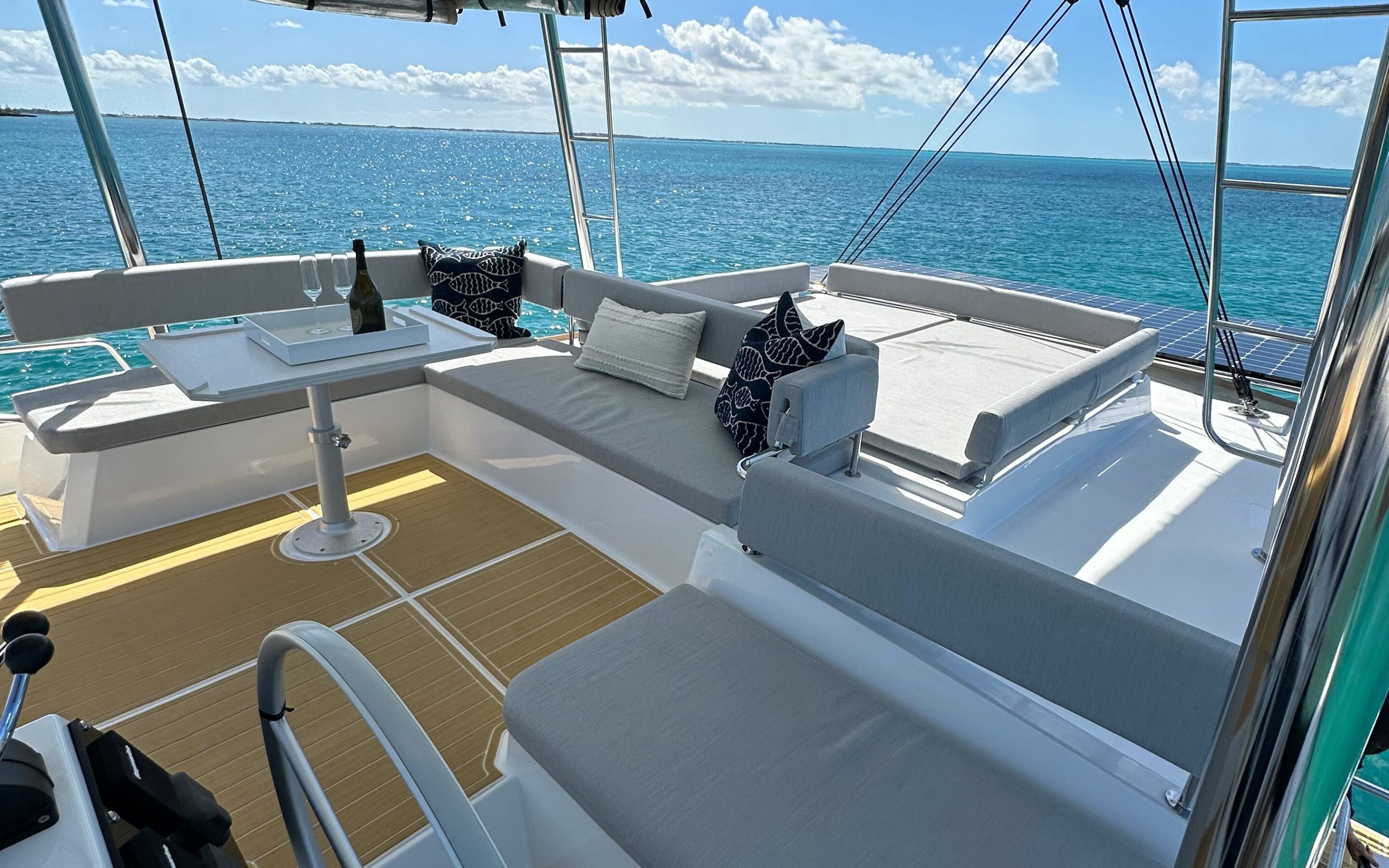 Interior view of a spacious catamaran featuring a large deck, showcasing a modern and inviting nautical design.
