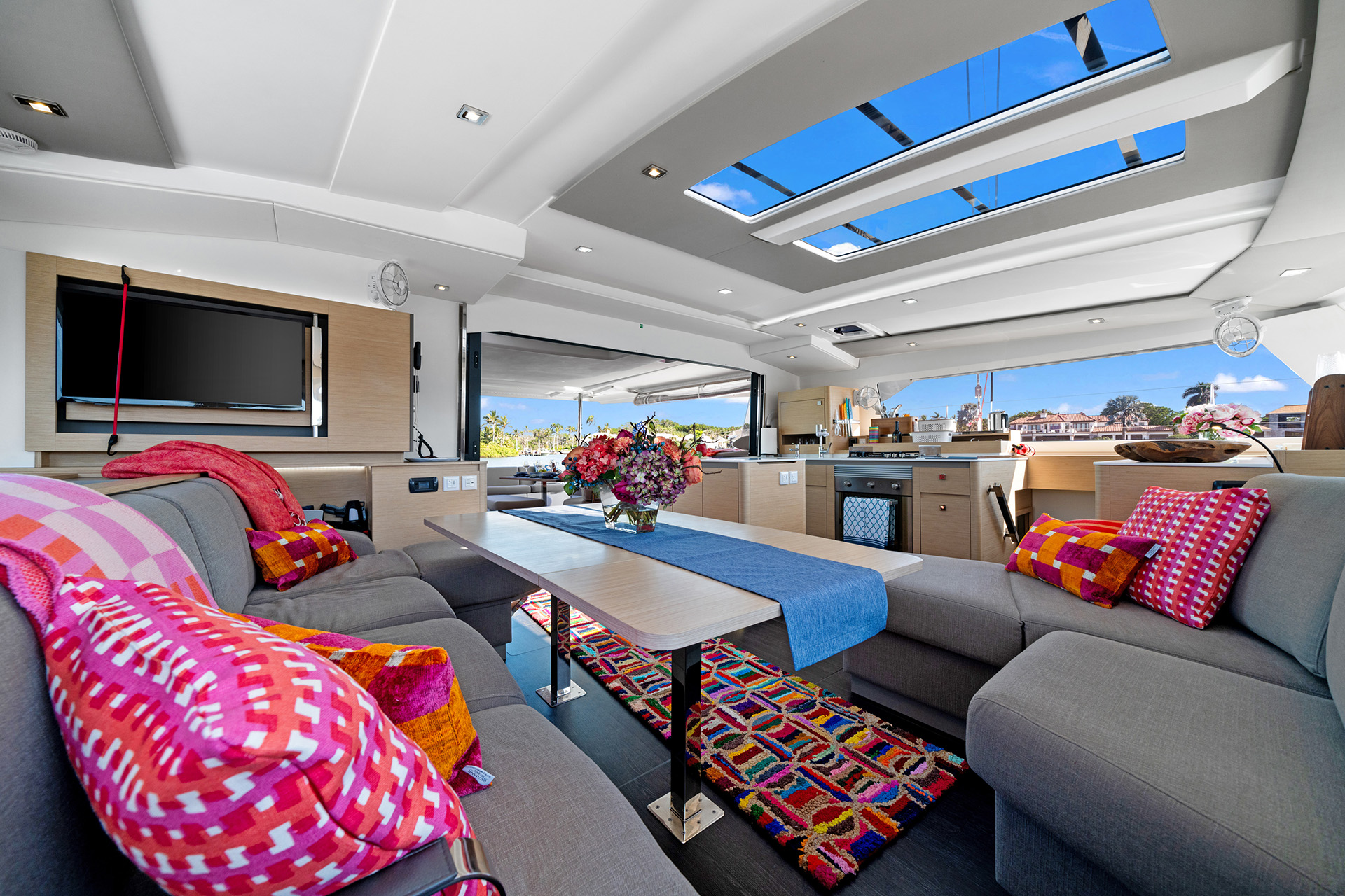 A cozy boat living room featuring a skylight that illuminates the space with natural light.