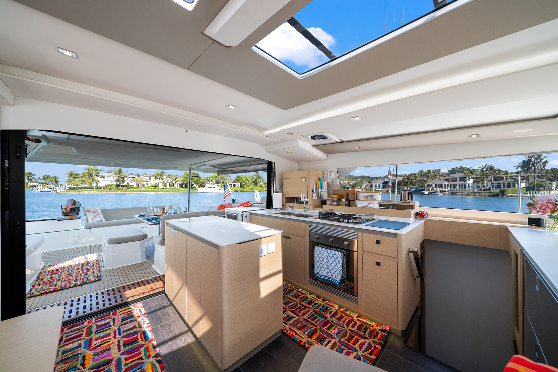 A well-equipped kitchen with a sink and stove top, emphasizing practicality and contemporary style.