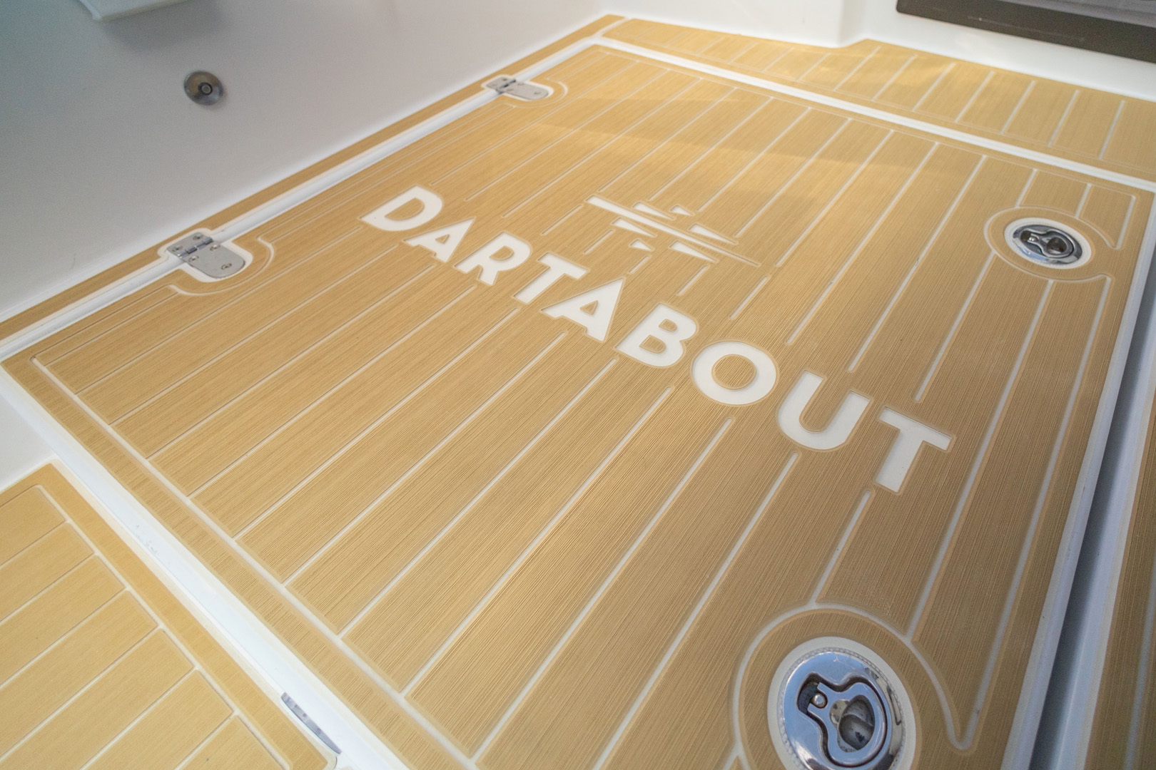 The floor of a boat featuring the word "dartabout" prominently displayed on its surface.