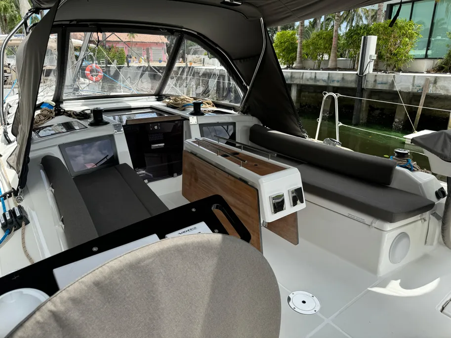 Inside a boat, a large screen is prominently displayed, highlighting a contemporary and functional interior space.
