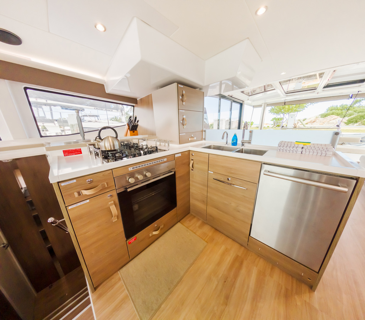 A kitchen featuring a sink and stove, showcasing a functional cooking space with essential appliances.
